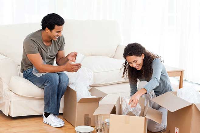 Couple Packing their Things in Boxes — Chicago, IL — Affordable Moving Company, Inc.